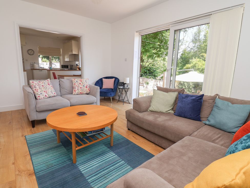 A living room with a coffee table and sofa at Hillcrest in Cefn Mawr near Chirk