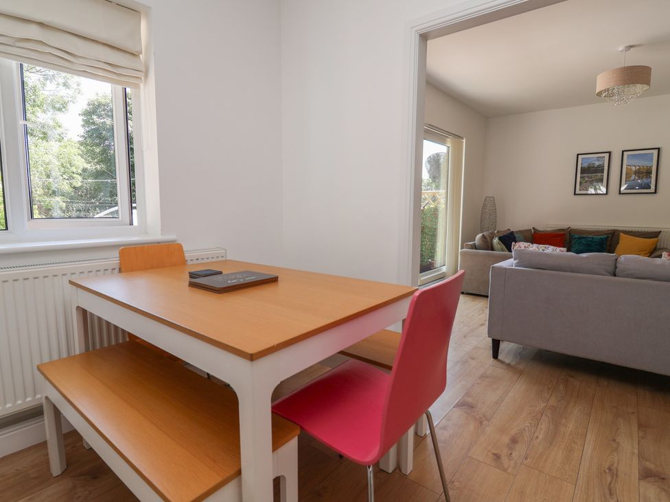 A dining area with a table and chairs at Hillcrest Cefn Mawr near Chirk