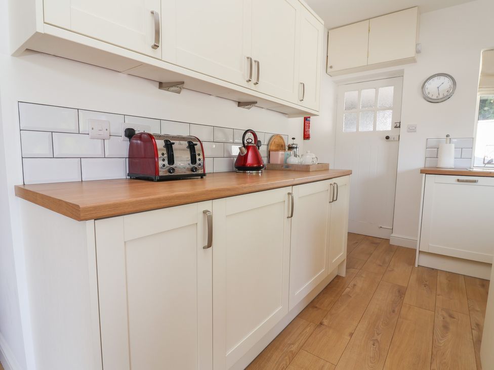 A kitchen with a kettle and toaster on the countertop at Hillcrest Cefn Mawr near Chirk