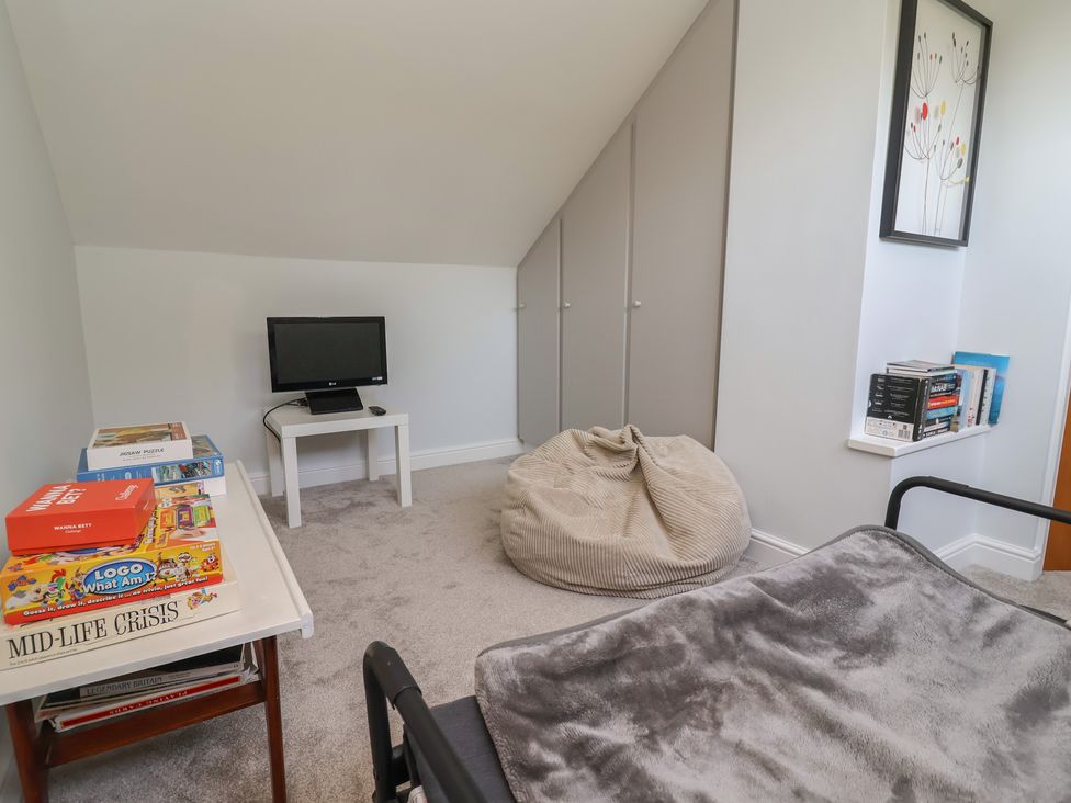 A spare room with a television and bean bag at Hillcrest in Cefn Mawr near Chirk