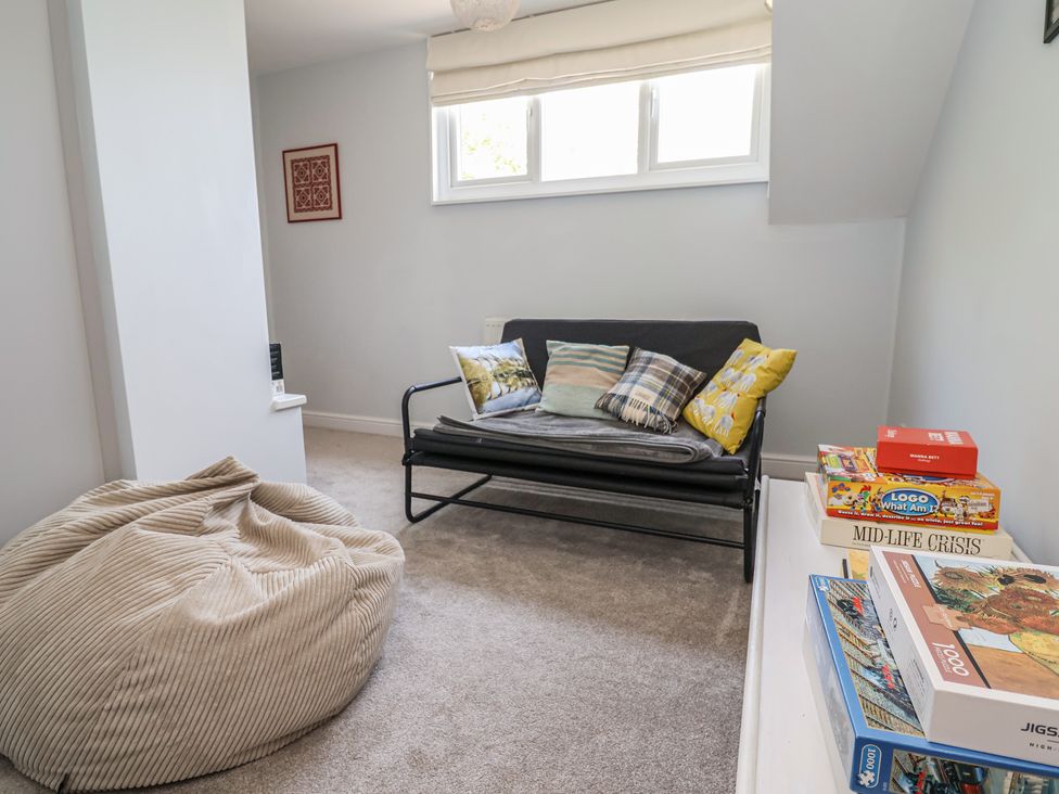 A snug with a sofa and bean bag at Hillcrest Cefn Mawr near Chirk