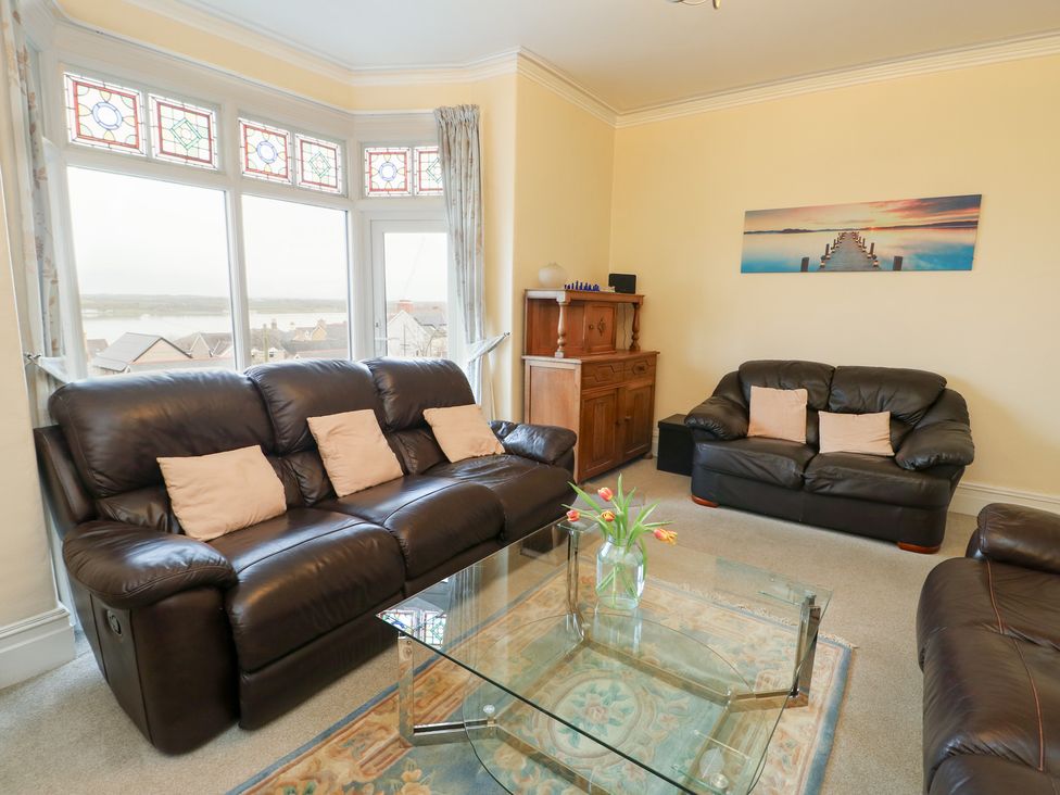 A living room featuring sofas and a coffee table at Preswylfa, Caernarfon