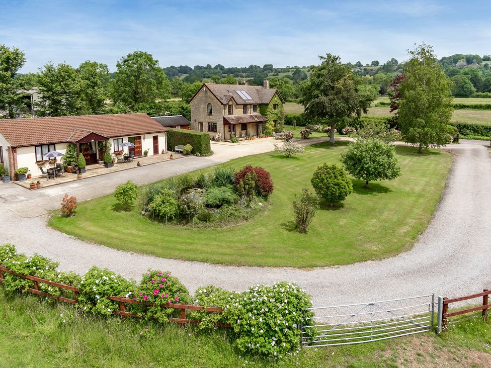 An outdoor view of a house and garden at Willow Barn in Cucklington near Wincanton