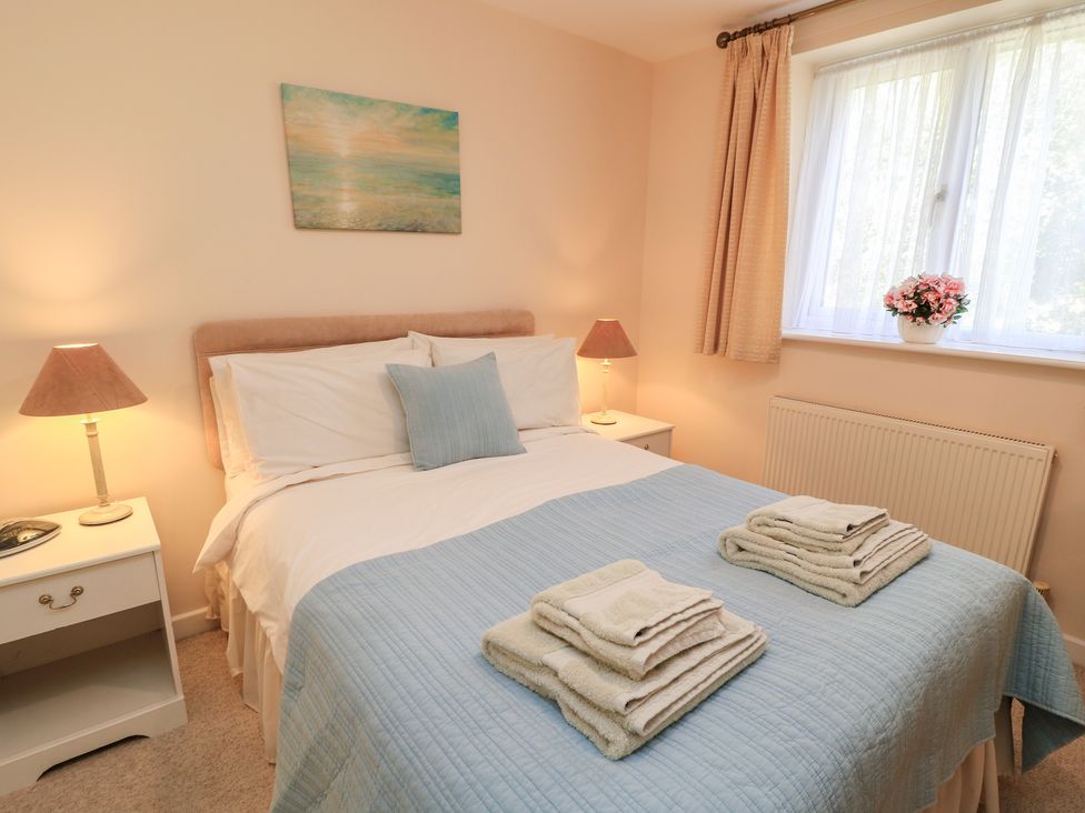 A bedroom with a bed and bedside tables at Willow Barn in Cucklington near Wincanton