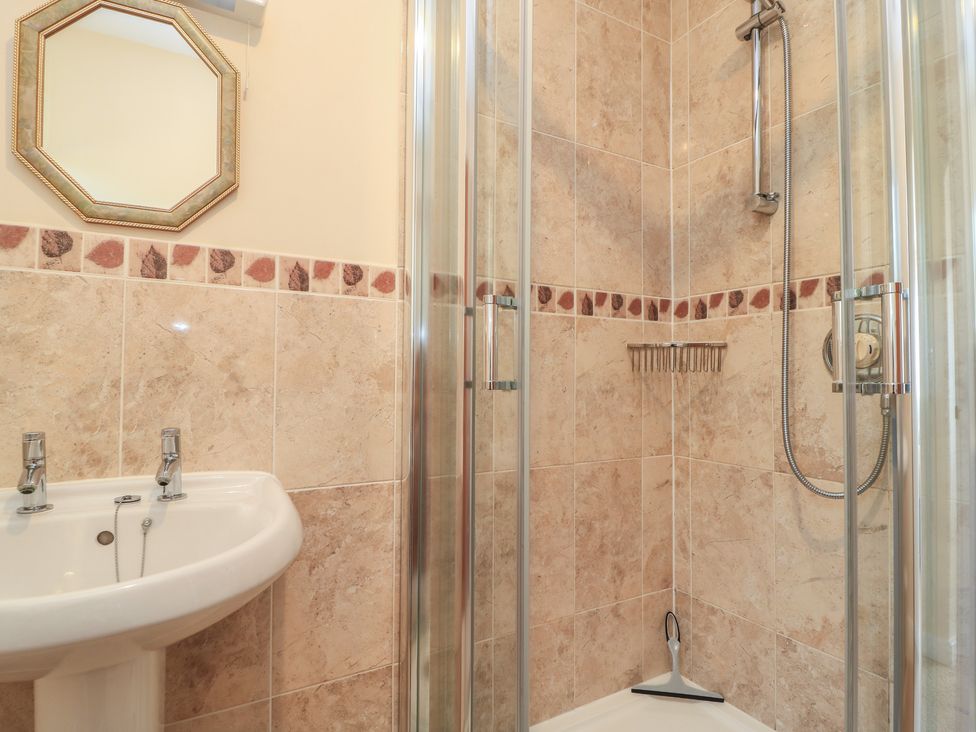 A bathroom with a sink and shower at Willow Barn in Cucklington near Wincanton