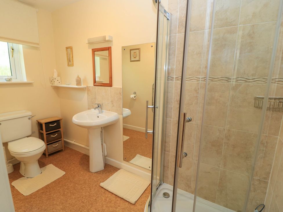 A bathroom with a shower and sink at Little Barn in Cucklington near Wincanton