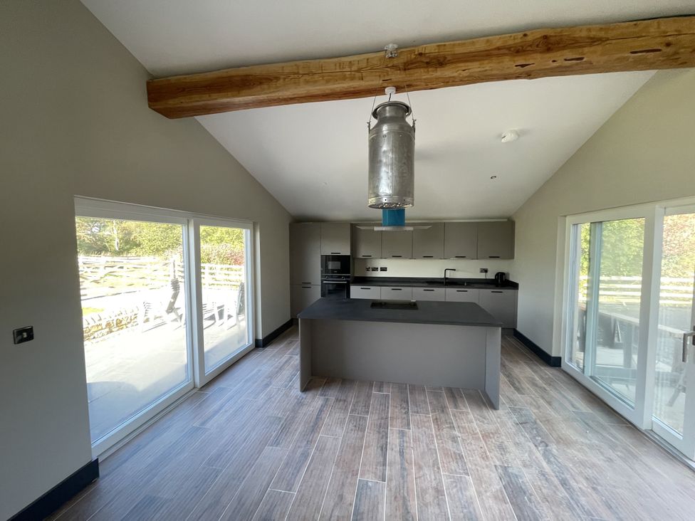 A kitchen with an island and appliances at 1 New Dairy Barn 