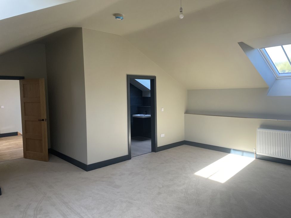 A room with a door and a window at 1 New Dairy Barn