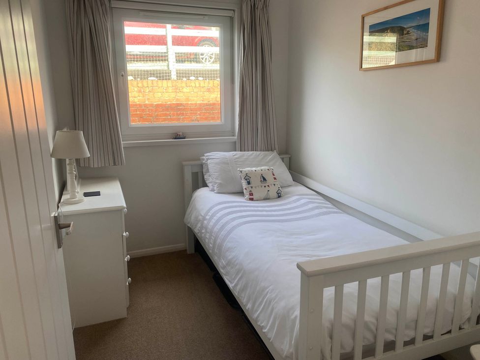 A bedroom with a bed and a window at Valley High in Solva