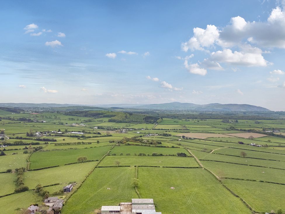 A panoramic view of fields and hills in Arosfa Axton near Trelawynd