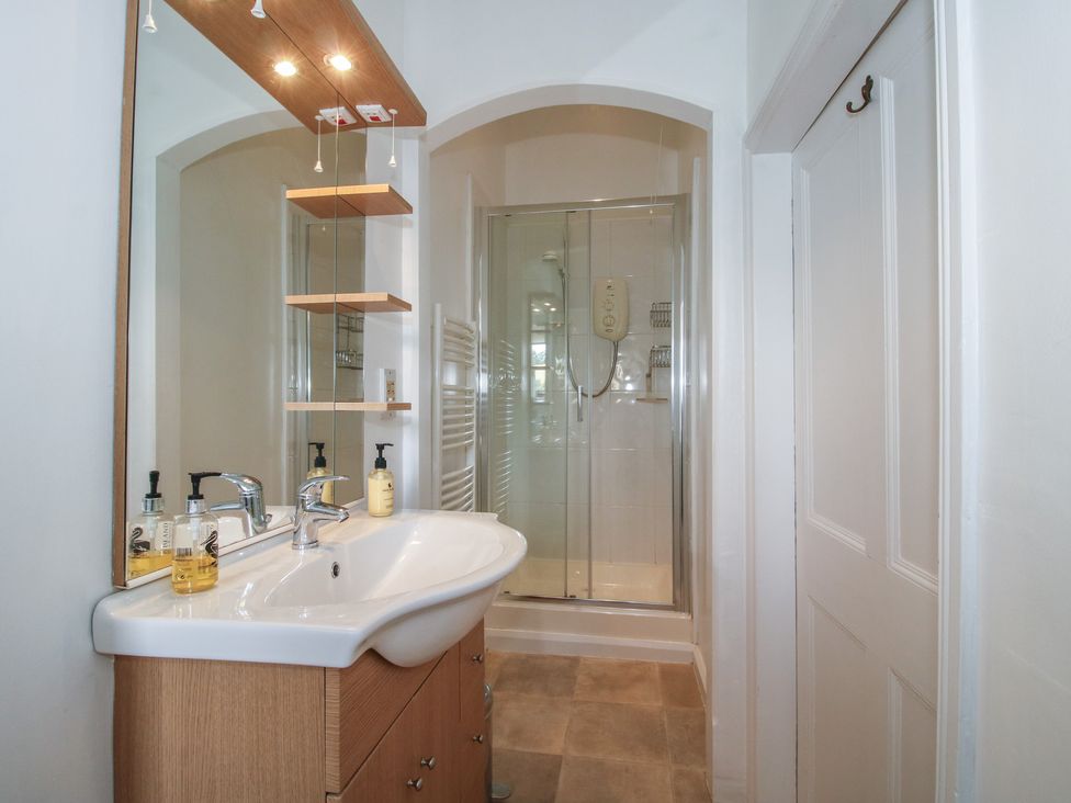 A bathroom with shower and sink at The Old Nursery in Bourton near Much Wenlock