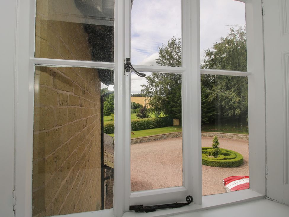 A view of a garden from a window at The Old Nursery Bourton near Much Wenlock