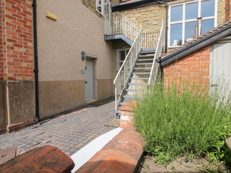 An outdoor area with stairs and a door at The Old Nursery in Bourton near Much Wenlock