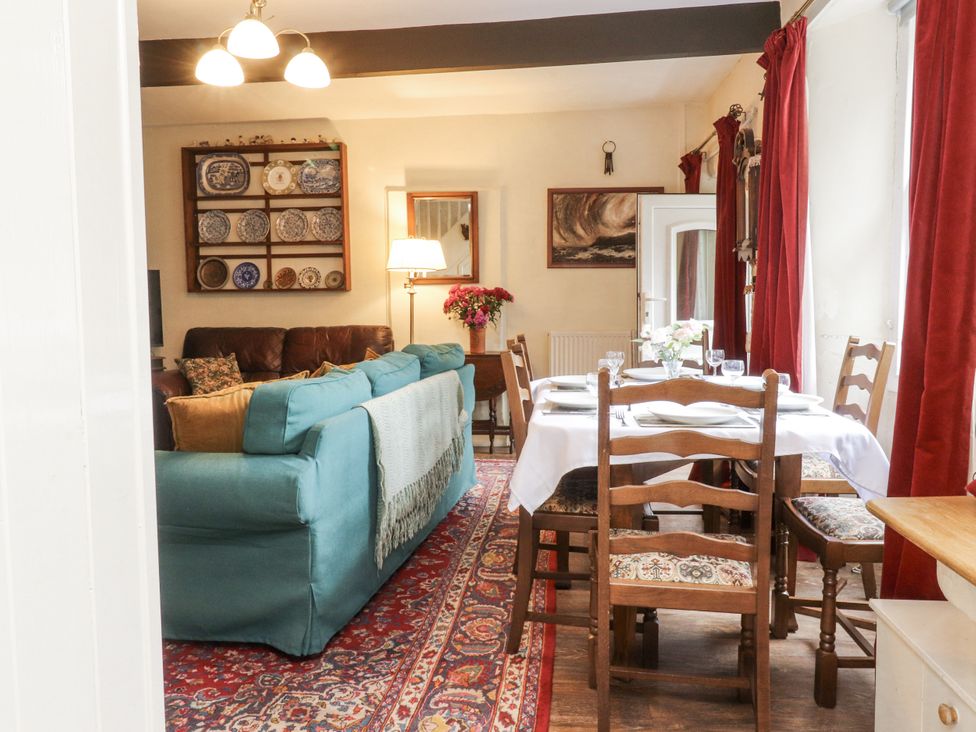 A dining room with a table and chairs at Bridgend Cottage in Eastby near Embsay