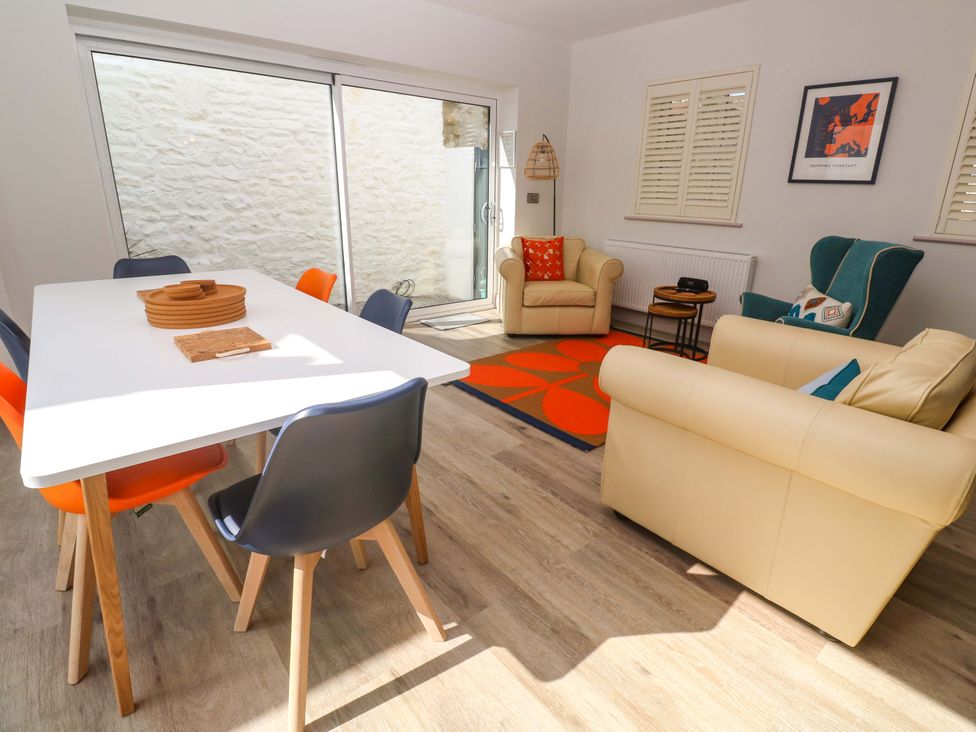 A dining room with a table and chairs at 21 Alverton Street Penzance