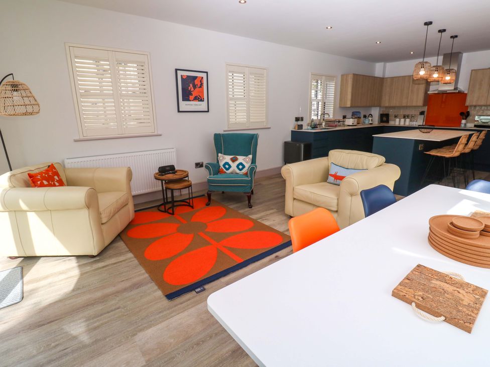 A living room with sofa and table at 21 Alverton Street in Penzance