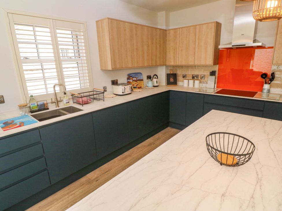 A kitchen with cabinets, sink, and countertop at 21 Alverton Street Penzance