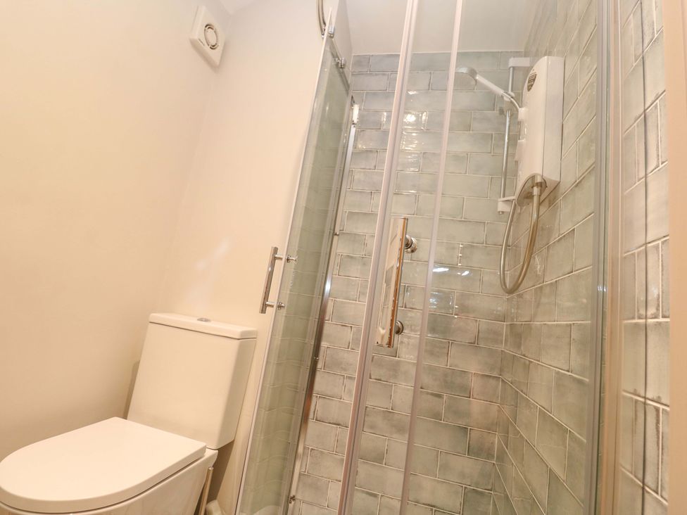 A bathroom with a shower and toilet at 21 Alverton Street Penzance