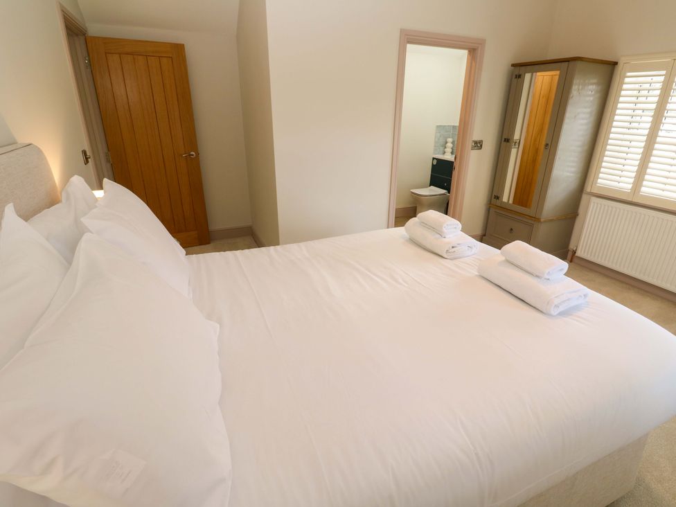 A bedroom with a bed and wardrobe at 21 Alverton Street in Penzance
