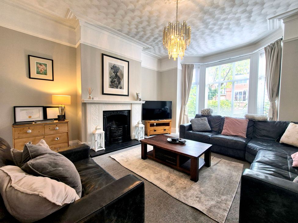 A living room with a sofa and coffee table at Royal Victoria House in Scarborough