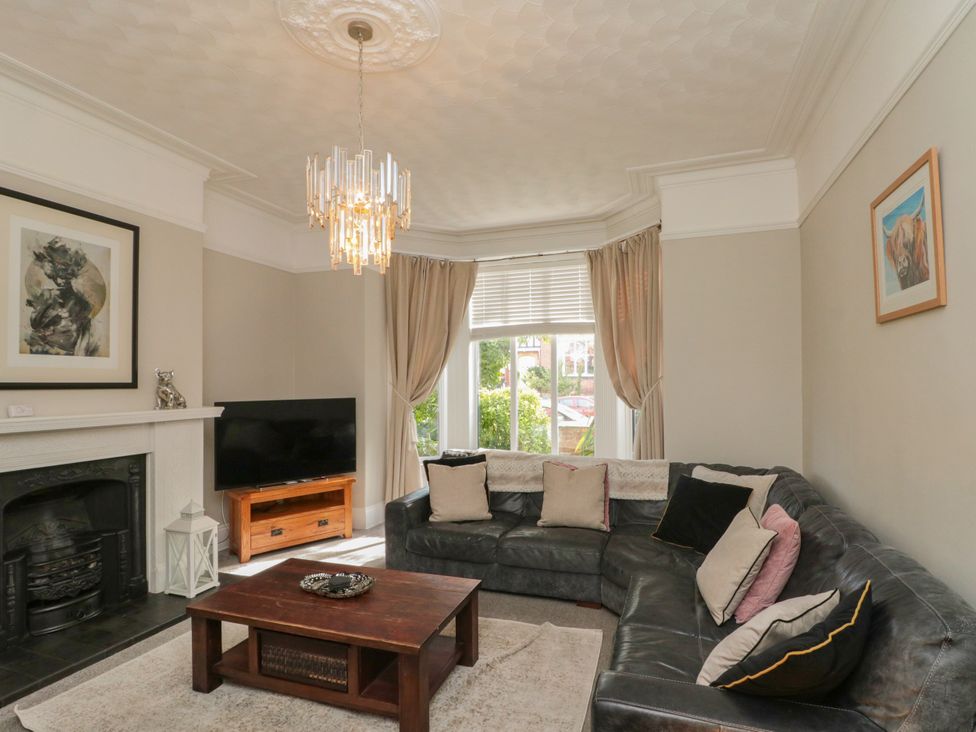 A living room with a sofa and coffee table at Royal Victoria House in Scarborough