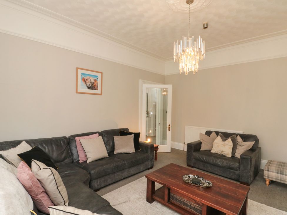 A living room with sofas and a coffee table at Royal Victoria House in Scarborough