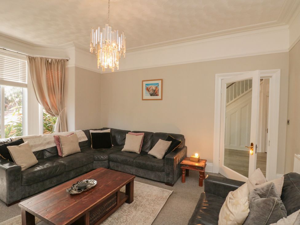A living room with a sofa and table at Royal Victoria House in Scarborough