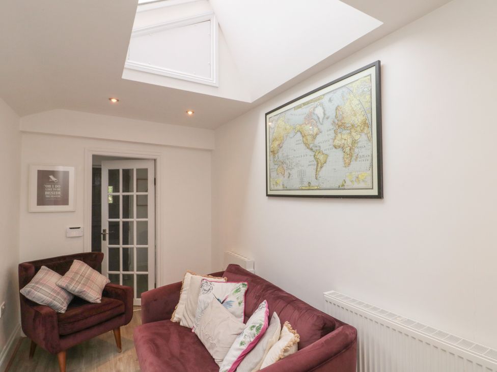 A living room with a map on the wall at Royal Victoria House in Scarborough