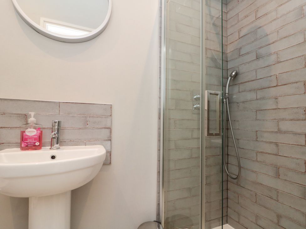 A washbasin and shower in a bathroom at Royal Victoria House Scarborough