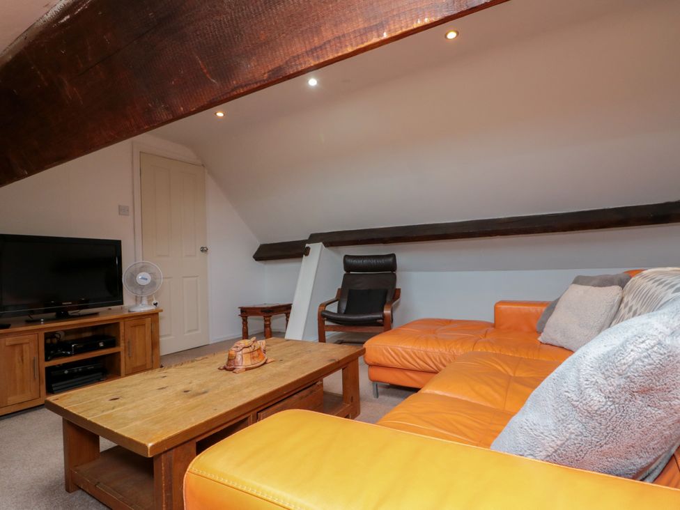 A living room with a sofa and coffee table at Royal Victoria House in Scarborough