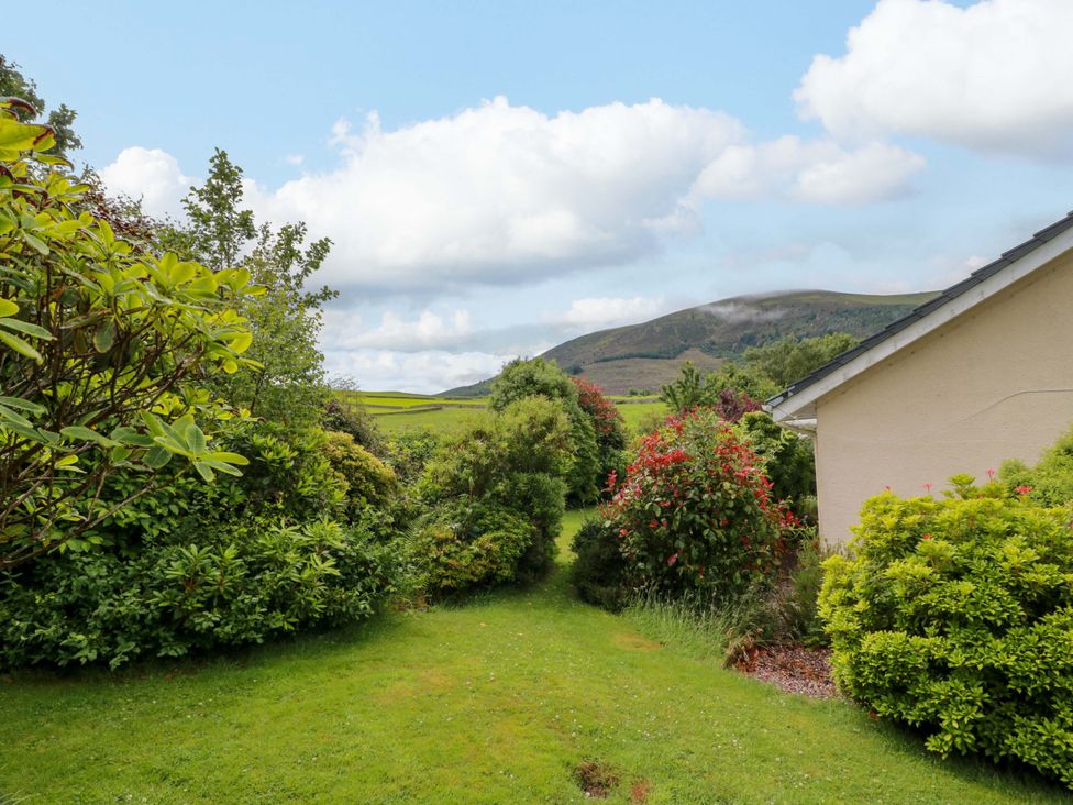 A garden with bushes and flowers at Knockendoch in New Abbey