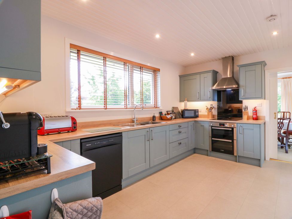 A kitchen with appliances and cabinets at Knockendoch in New Abbey