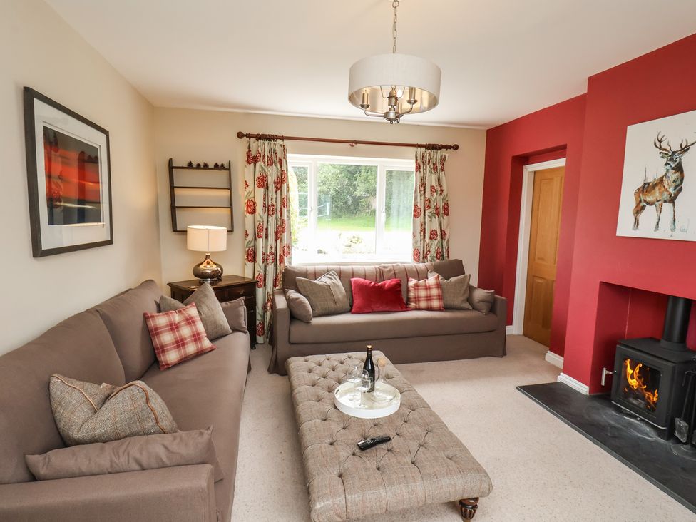 A living room with sofas and a coffee table at 21 Eskdaleside Sleights