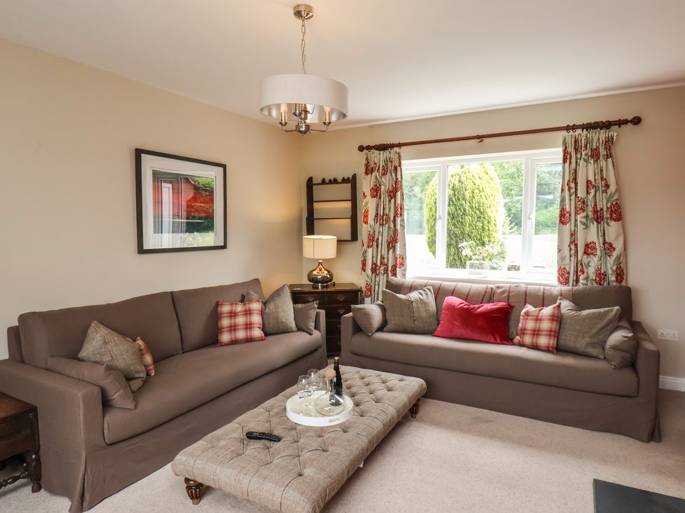 A living room with sofas and a coffee table at 21 Eskdaleside Sleights