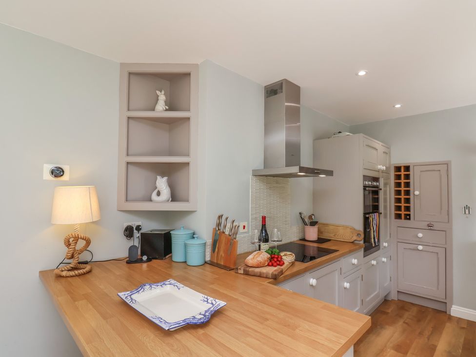 A kitchen with a countertop and appliances at 21 Eskdaleside Sleights