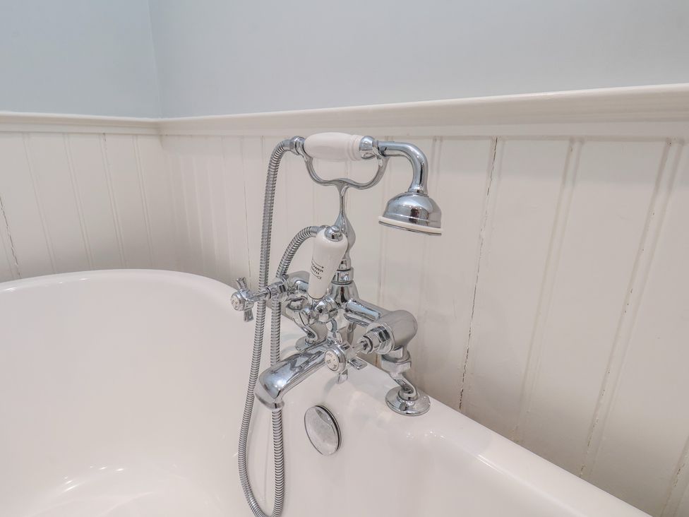 A bath tub with chrome faucet and showerhead at 21 Eskdaleside Sleights