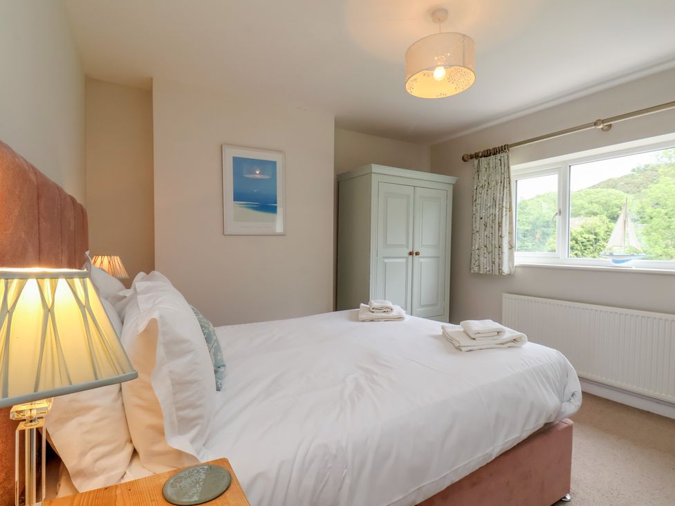 A bedroom with a bed and wardrobe at 21 Eskdaleside, Sleights