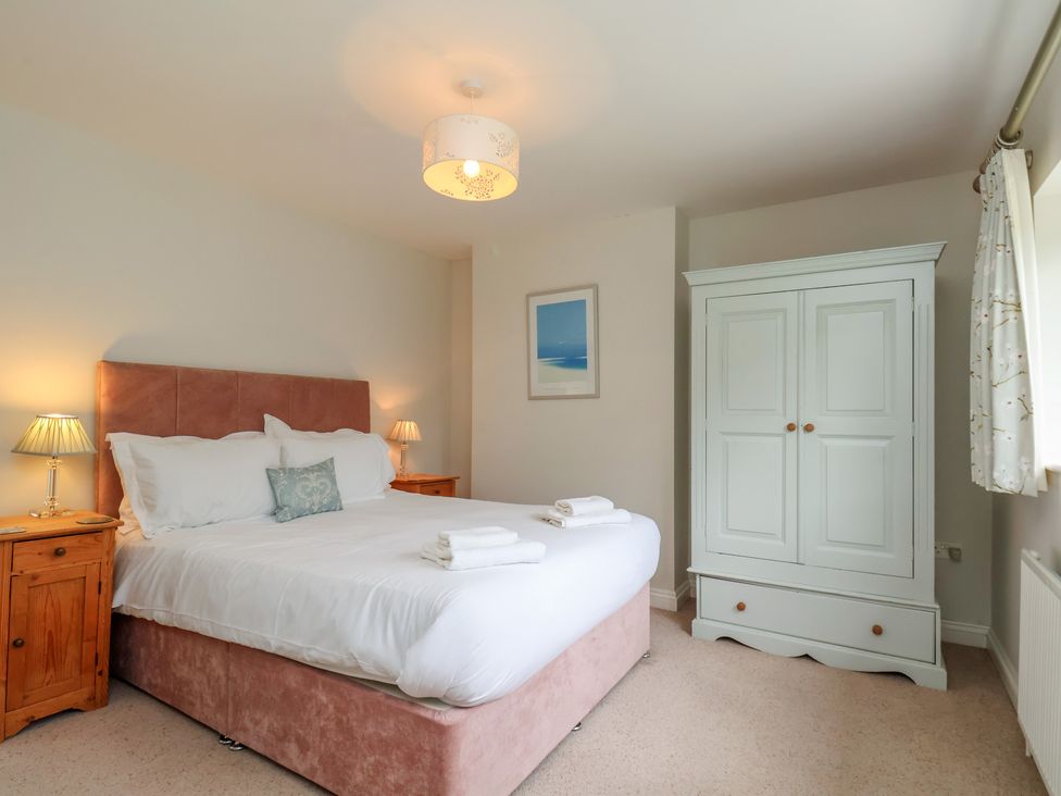 A bedroom with a bed and wardrobe at 21 Eskdaleside Sleights