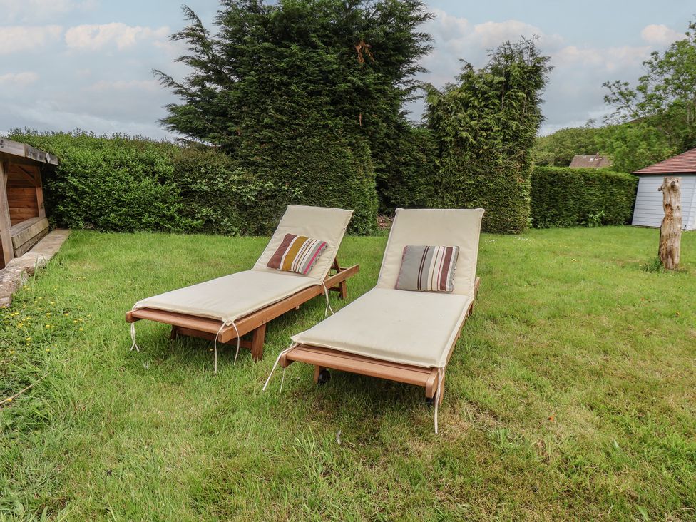 Two sun loungers on grass in a garden at 21 Eskdaleside Sleights