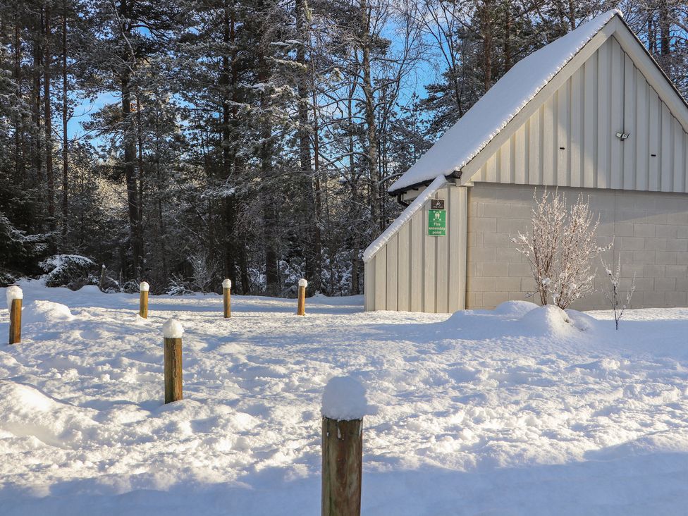 A building surrounded by snow at Wildcat Lodge in Feshiebridge near Aviemore