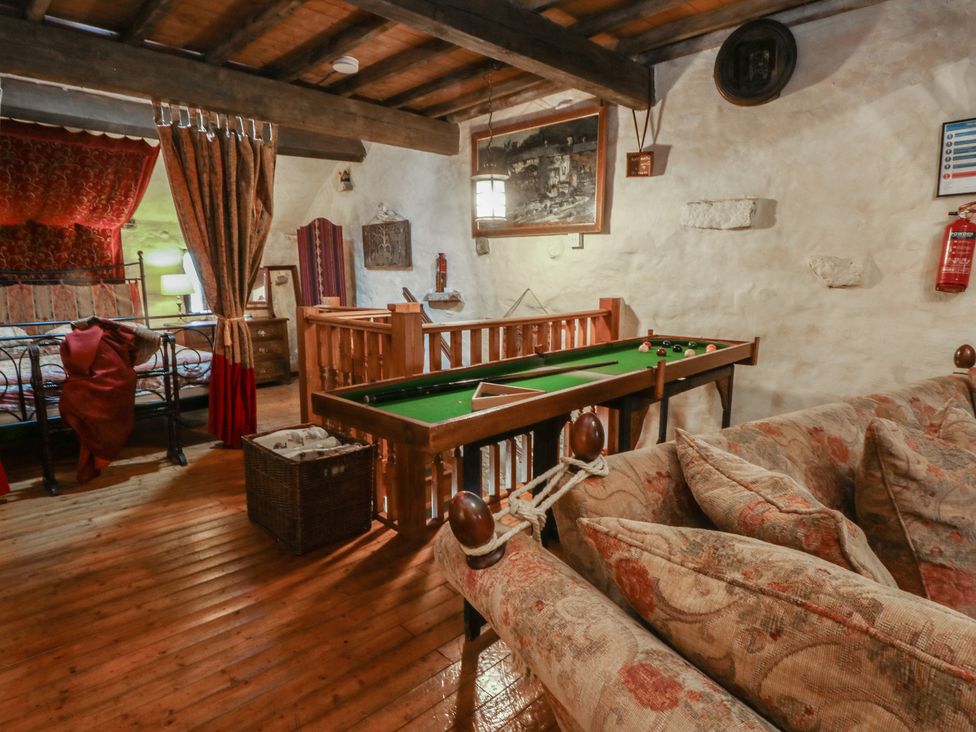 A snug with a pool table and a bed at Moldy Warp Barn in Haworth