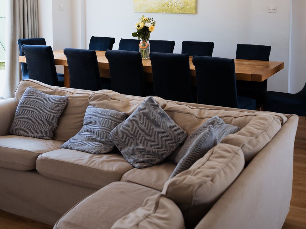 A dining room with a table and chairs at Newfield Farm Cottages Pimperne near Blandford Forum