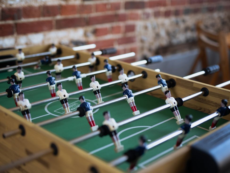 A foosball table with players at Newfield Farm Cottages Pimperne near Blandford Forum
