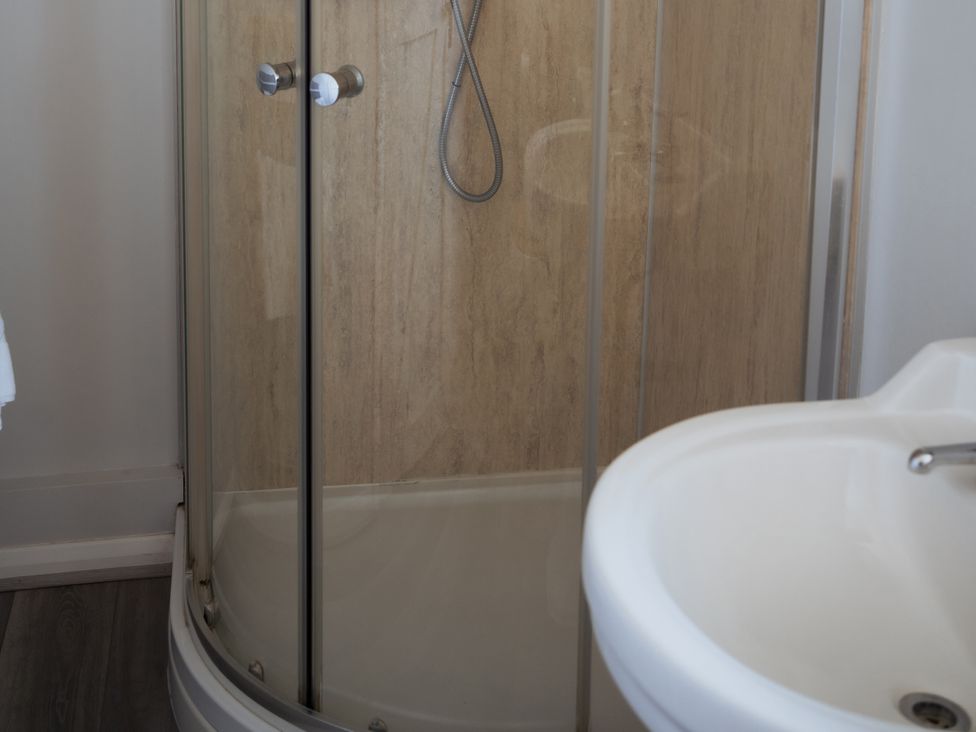 A bathroom with a shower and sink at Newfield Farm Cottages Pimperne near Blandford Forum