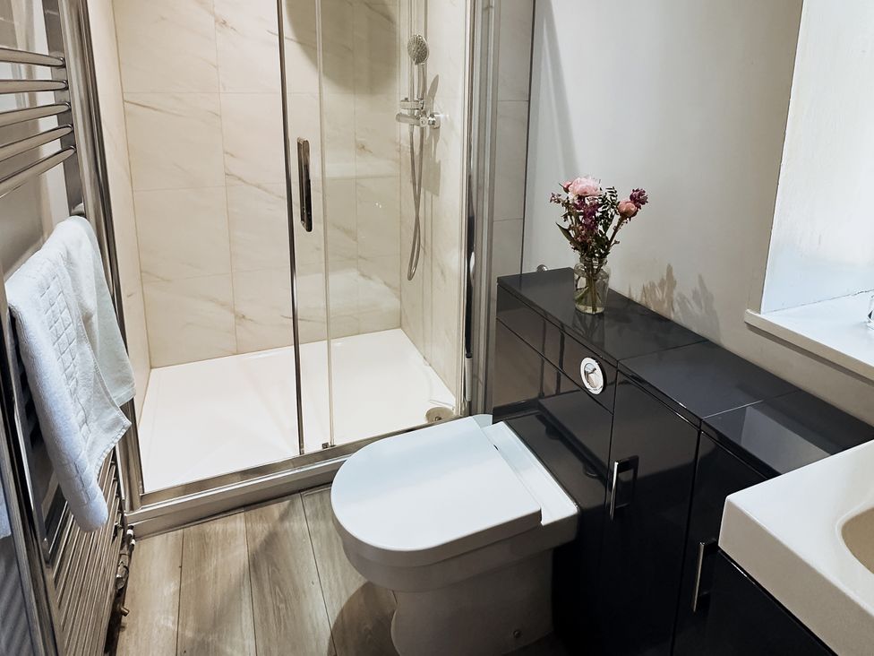 A bathroom with a shower and sink at Newfield Farm Cottages Pimperne near Blandford Forum