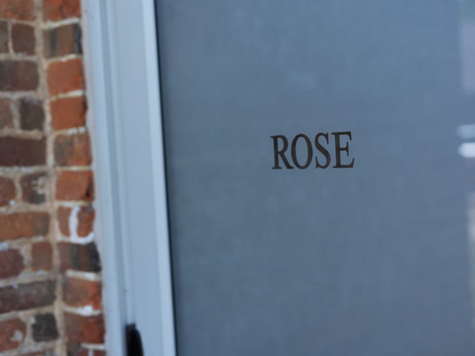 A door with the name 'ROSE' at Newfield Farm Cottages in Pimperne near Blandford Forum