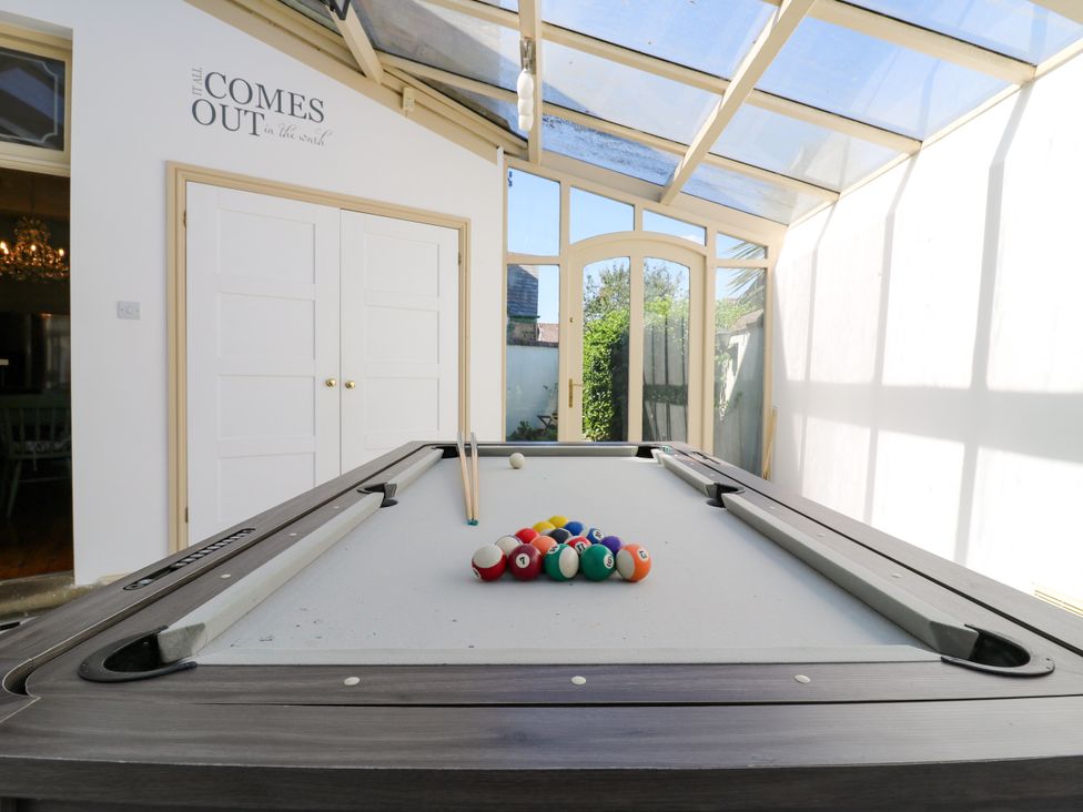 A game room with a pool table and a glass roof at The Chestnuts in Peterborough