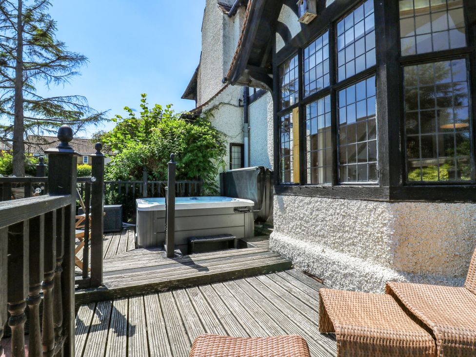 Outdoor area with a hot tub and seating at The Chestnuts in Peterborough