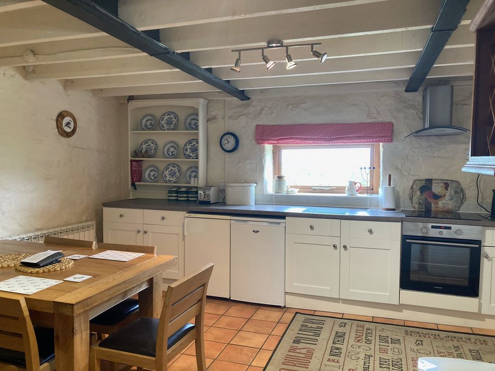 A kitchen with a table and chairs at The Granary in Mansergh near Kirkby Lonsdale