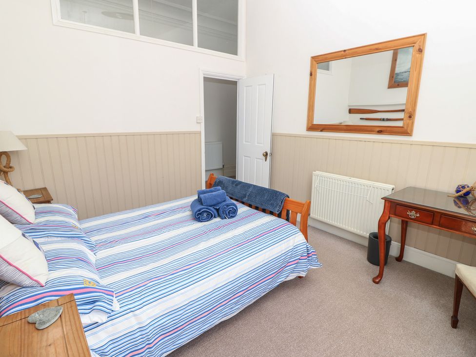 A bedroom with a bed and desk at Lancaster House Sandown